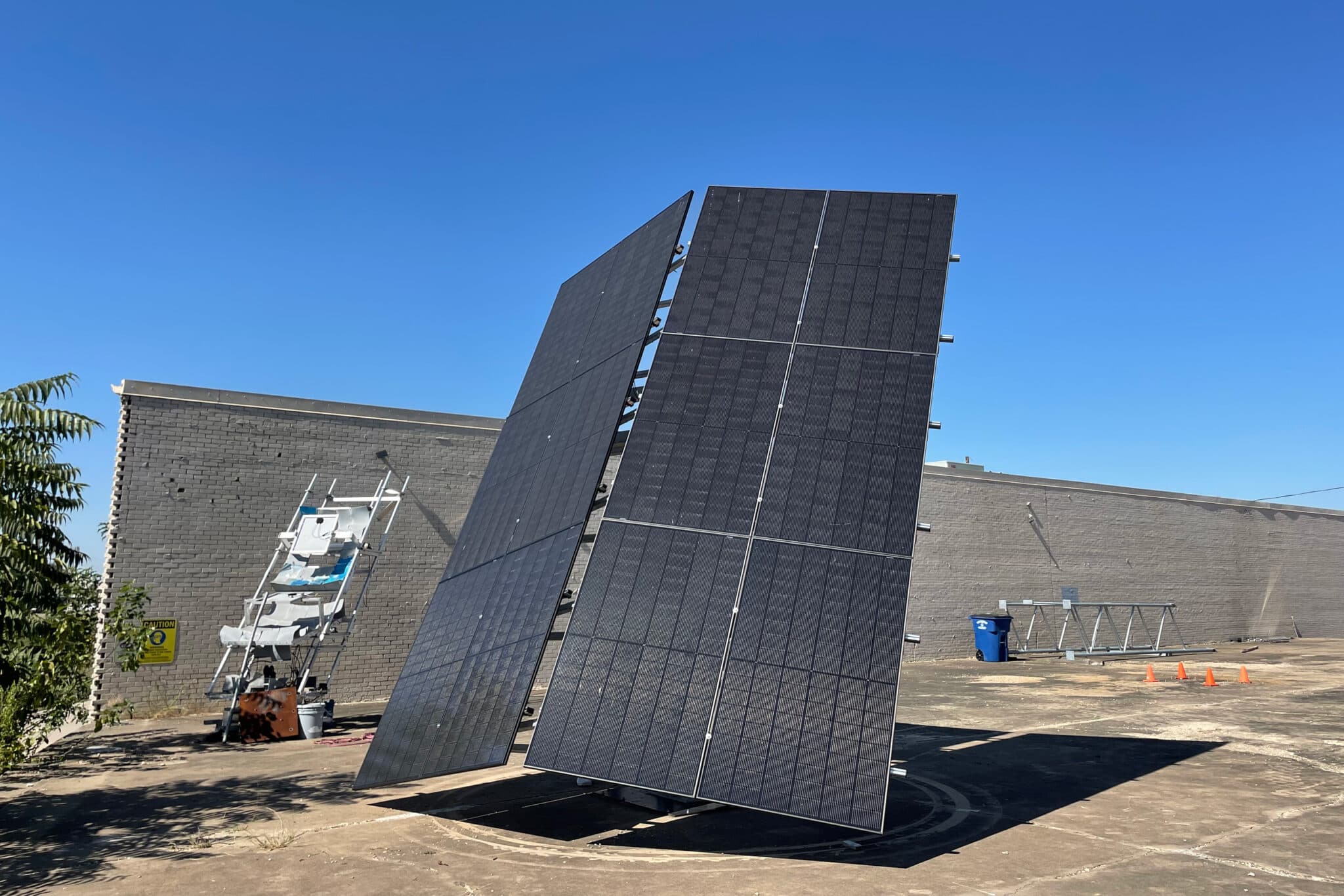 NATiVE Solar crew installing solar panels in the field.