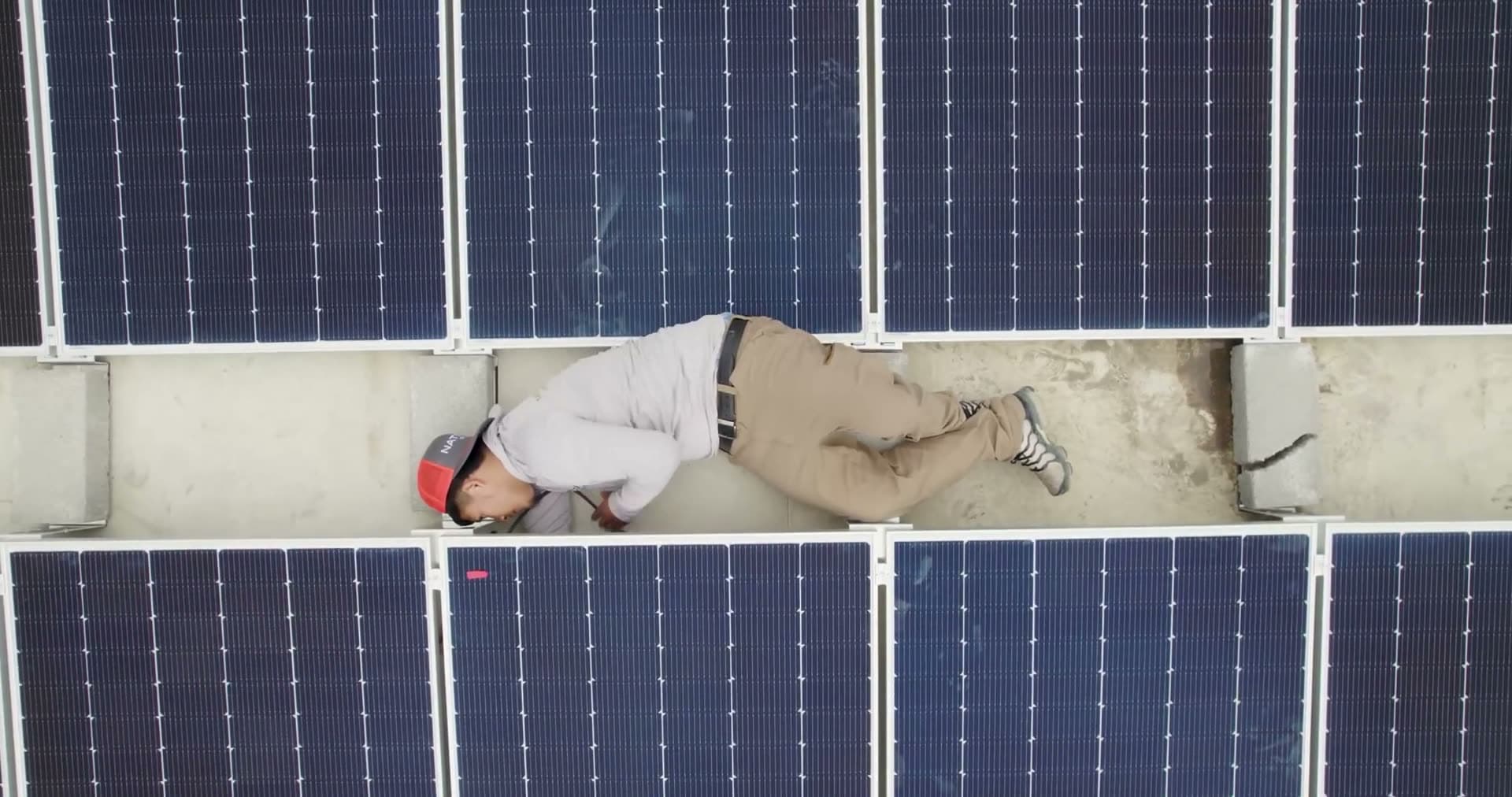 Overhead view of a completed residential rooftop solar array.