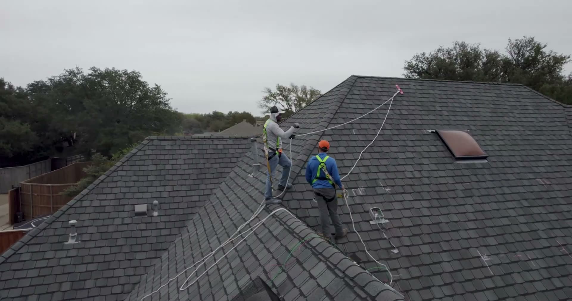 A NATiVE Solar crew setting panels on a residential roof.